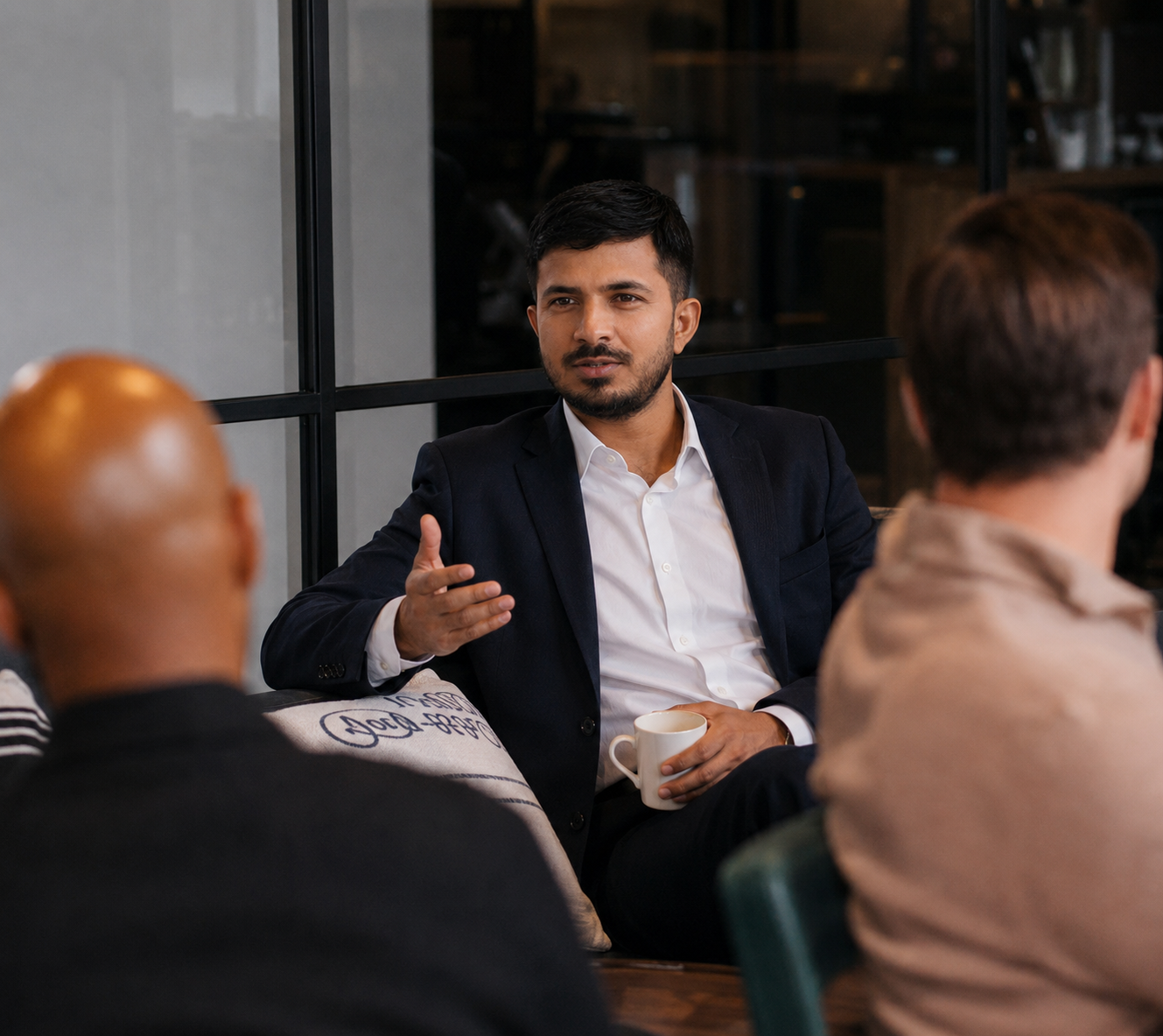 Founder in a strategy conversation with colleagues